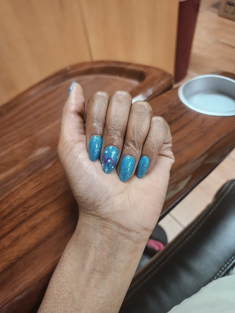 Close-up of a fresh gel manicure with glossy color.